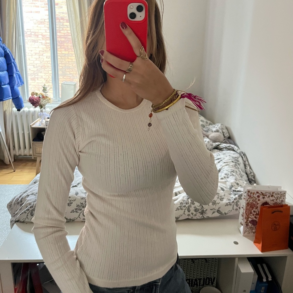 Cream long-sleeve T-shirt by Brandy Melville.